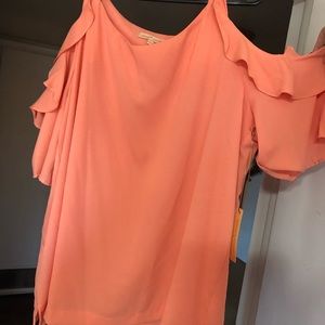 Peach off the shoulder shirt.